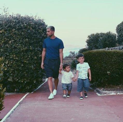Katia Ancelotti's husband, Mino Fulco, along with their kids.